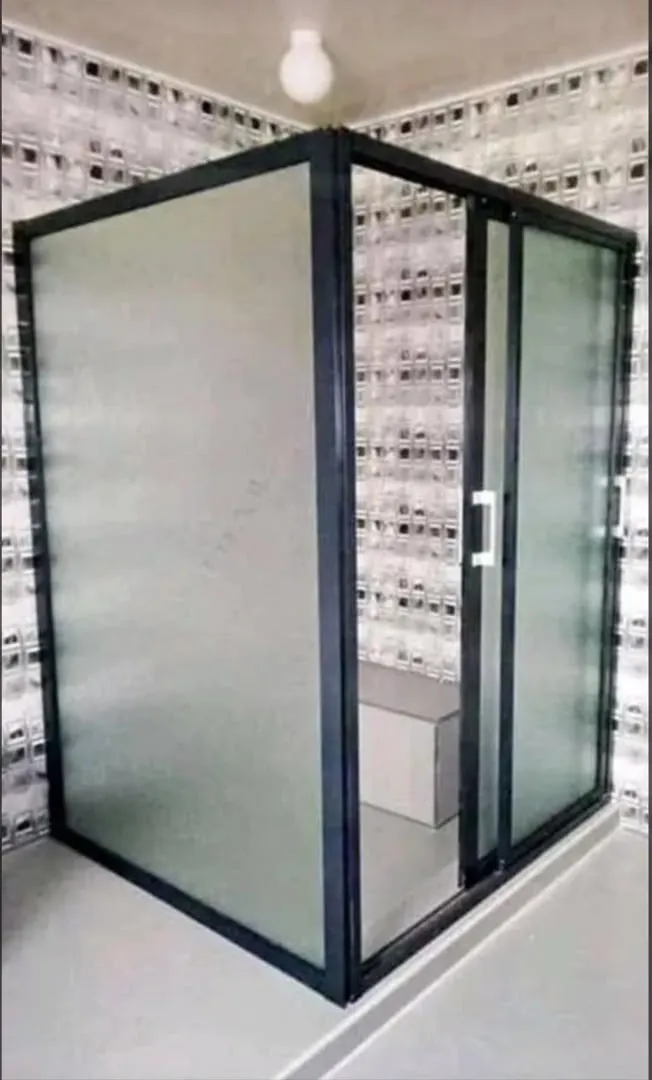 Black aluminium shower enclosure with frosted glass